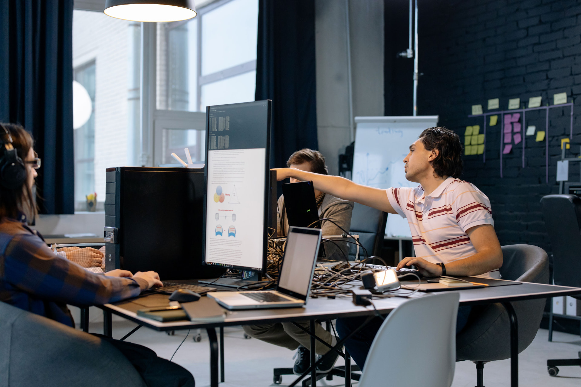 Small technology team collaborating in an office